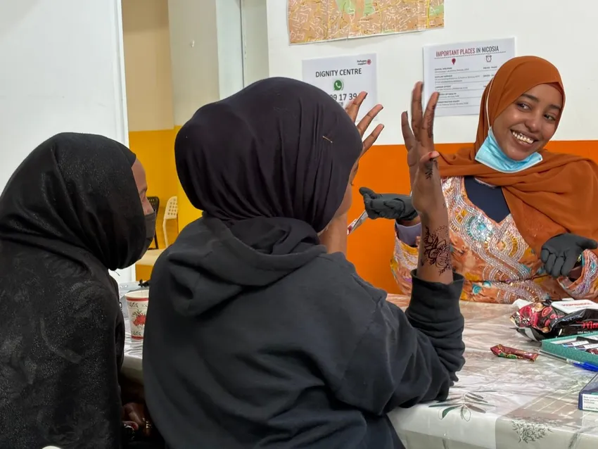 One of our members, Shukria, offers henna painting in the Dignity Centre.