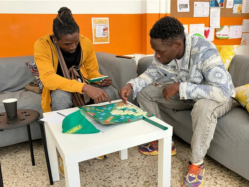 Relaxing and playing games in the Dignity Centre brings a sense of normality back to life.