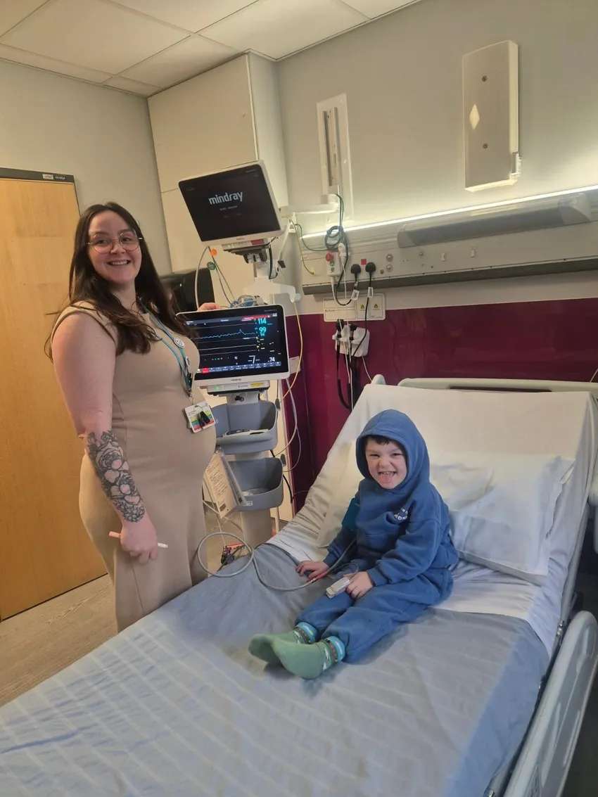 Young patient on Tiger Ward with parent