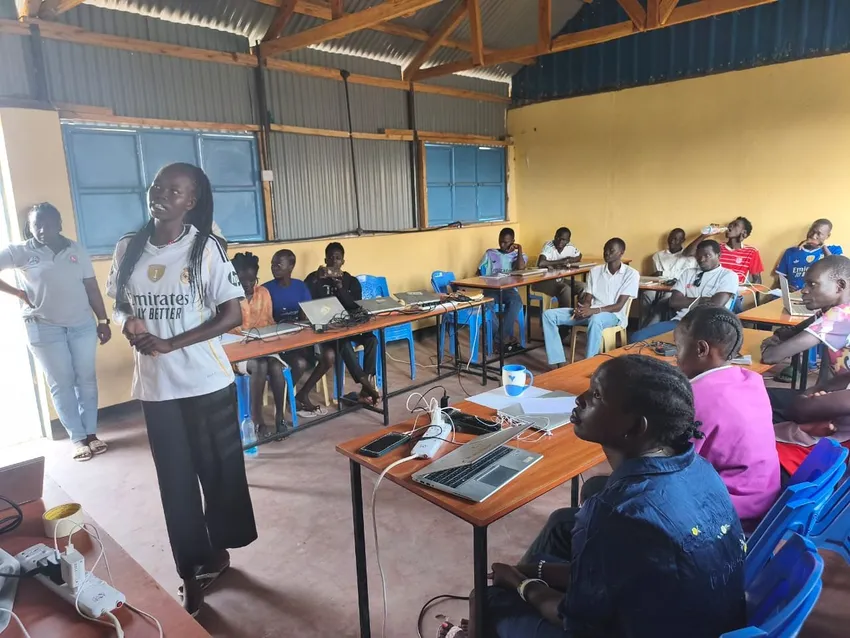 Female student presenting community project to class