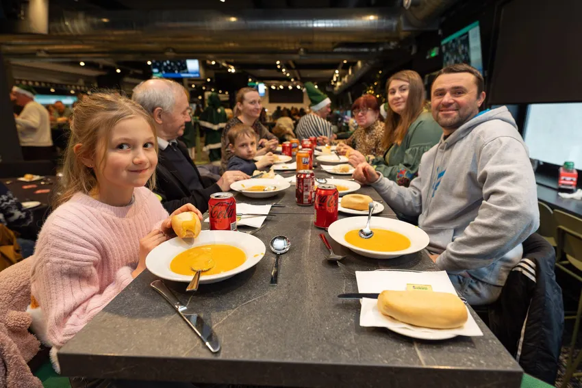 Ukrainian family enjoying Christmas Meal at Easter Road Stadium