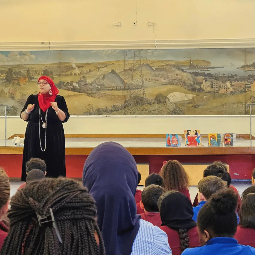 Award winning author Onjali Q. Raúf leading an assembly at a Wandsworth primary school as part of Learn to Love to Read's programme of author visits