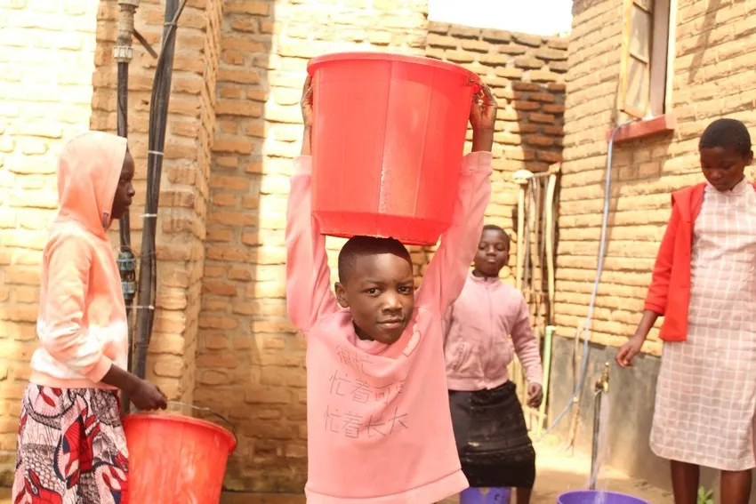 Students delivering water