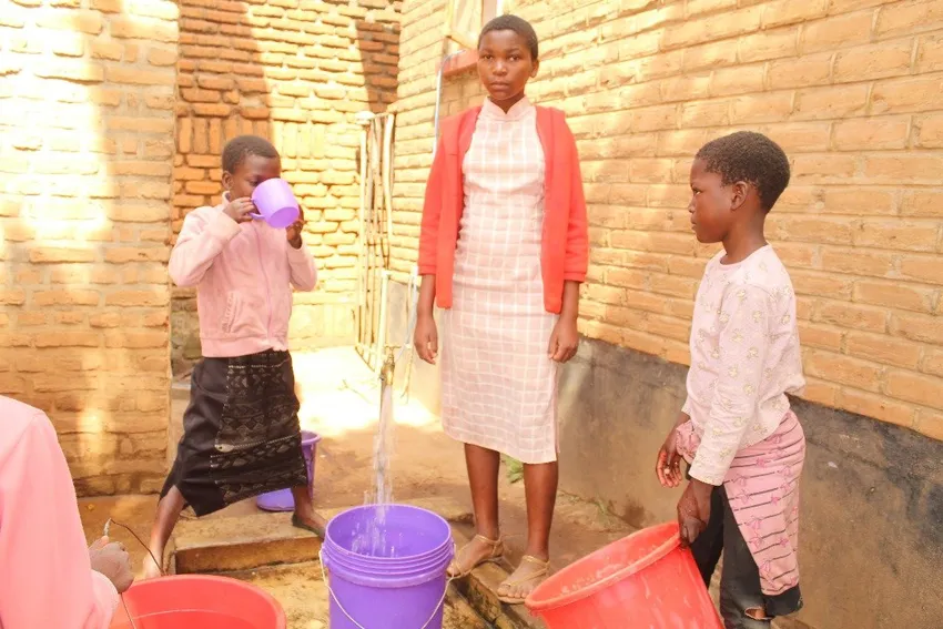 Students collecting water