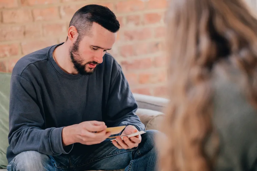 James' Place client looking at therapy cards with therapist