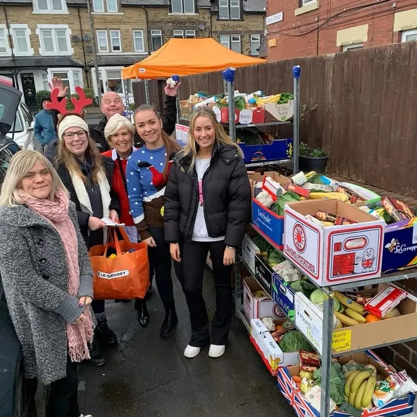 CEO & volunteers with James from Roots & Fruits delivering Christmas food hampers.