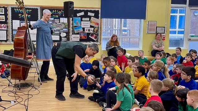 Ensemble Reza performing music story to primary students and introducing the bouzouki