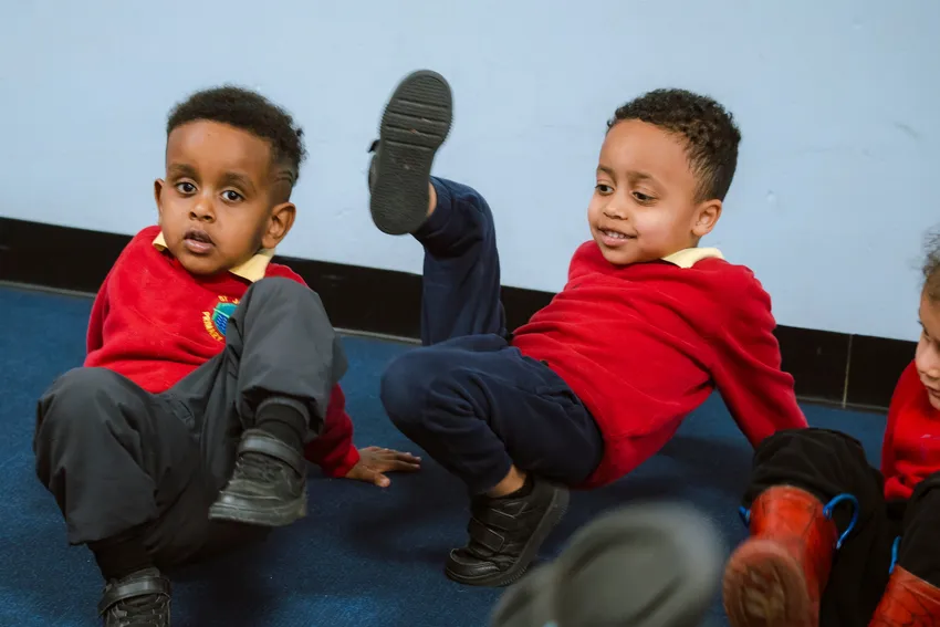 Two boys dancing.
