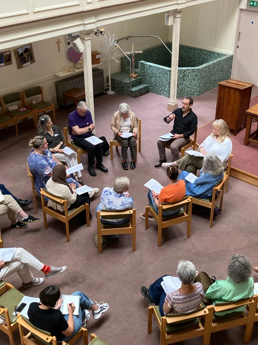 Group of people sat in a circle for circle training