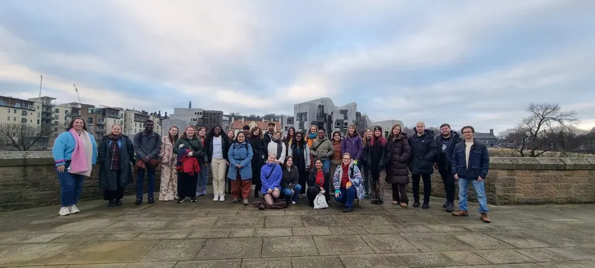 Climate Action Leadership Programme (CALP) group picture overlooking the Scottish Parliament December 2025