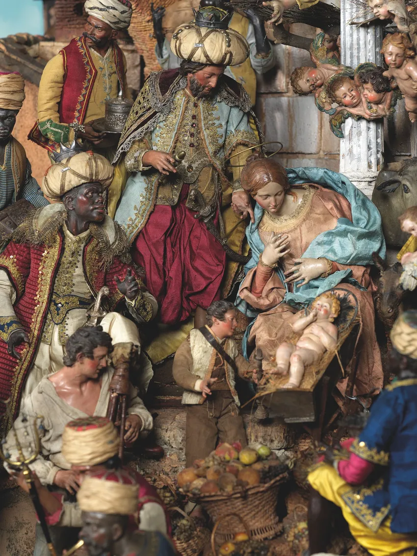 The Holy Family, surrounded by magi and cherubs: some of the figures were created by leading artists and sculptors of the day. Clothes feature patterns and brocades all recreated to scale.