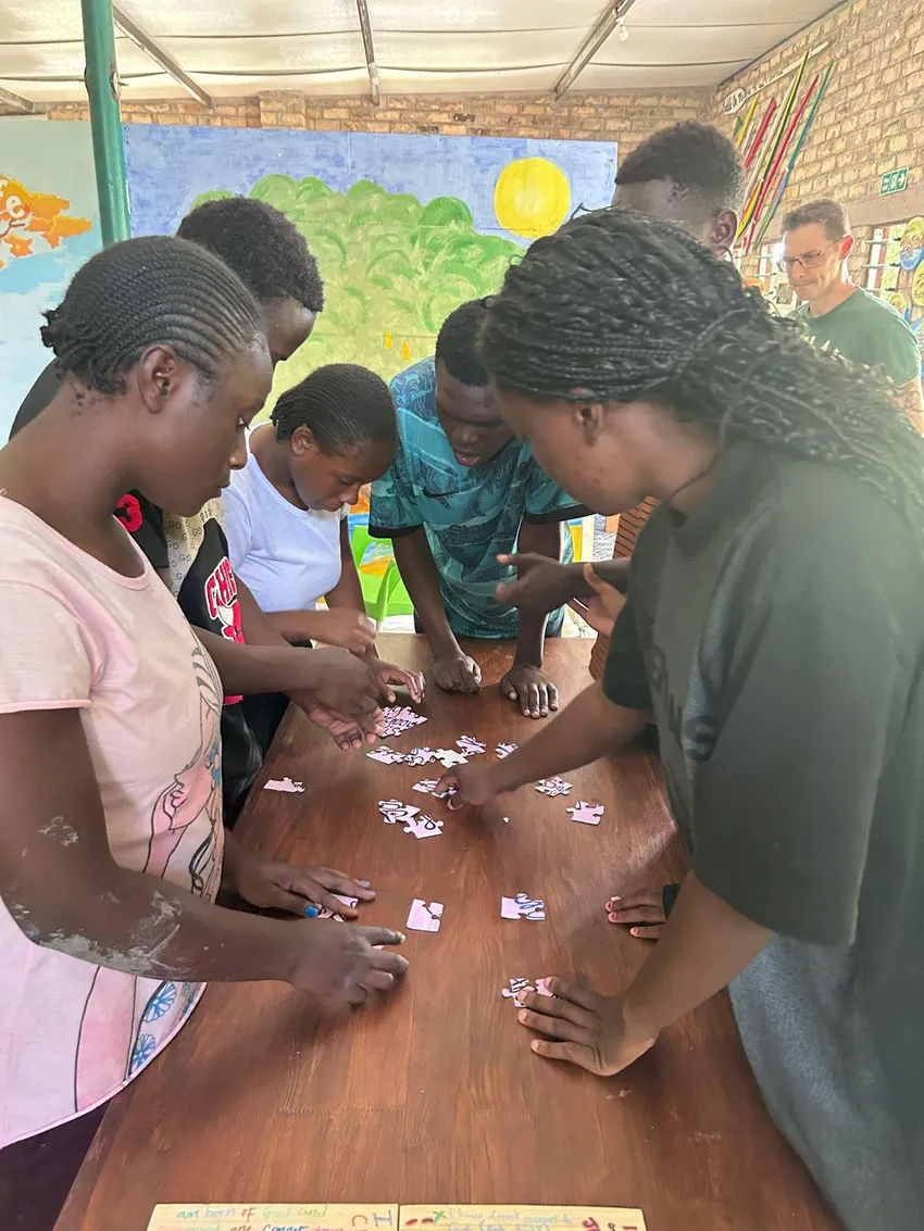 Young people working together to solve a puzzle