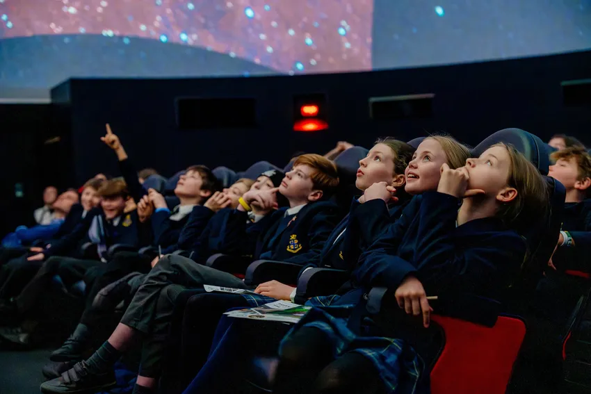 Pupils watching a Planetarium show at Dynamic Earth