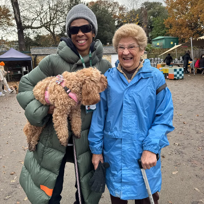 Volunteer with her dog and CareDogs client, on a befriending walk