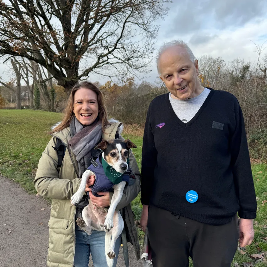Client with volunteer and CareDog on a befriending walk